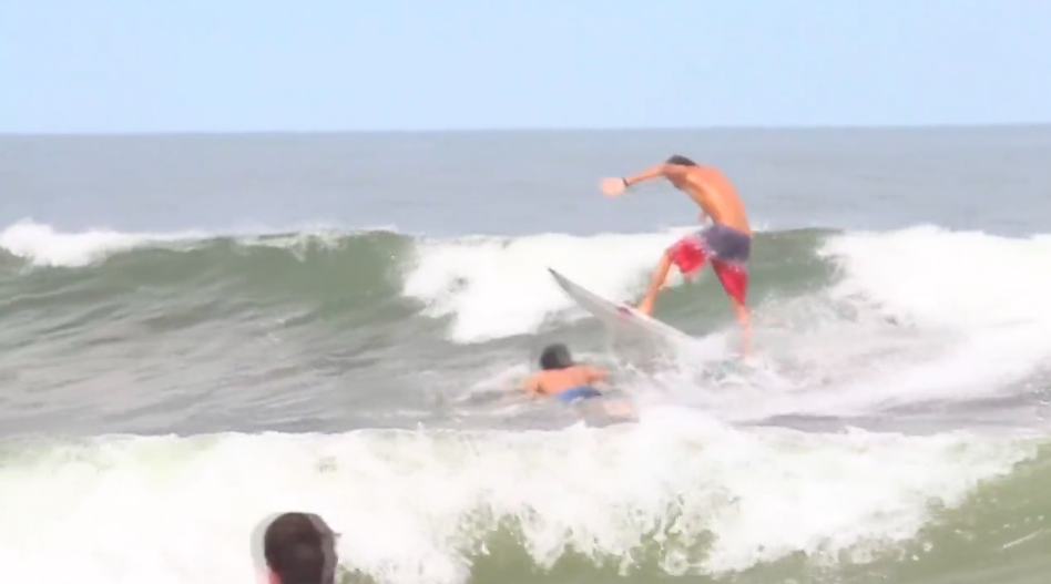 Thiago Camarão jumping over a dude.